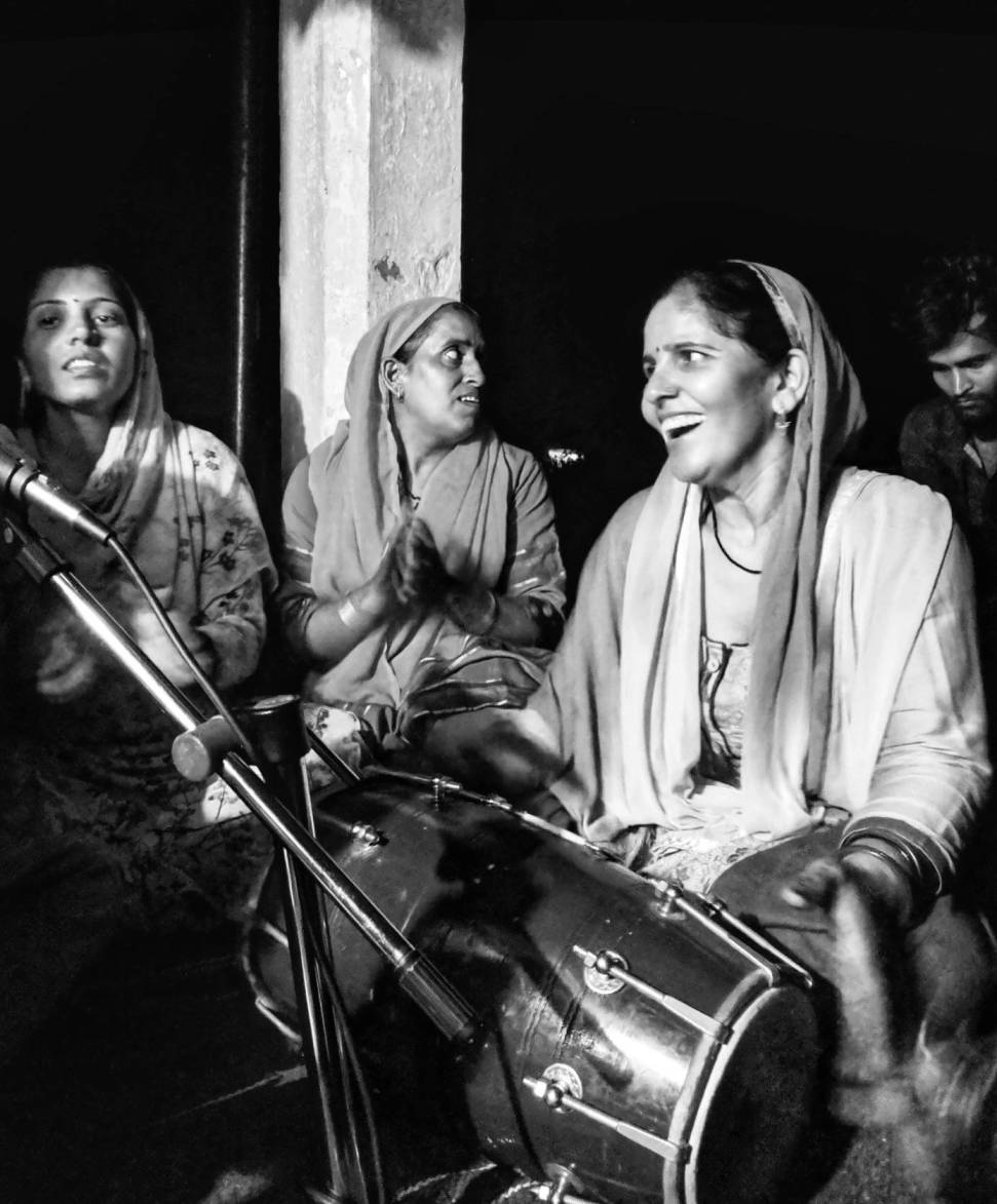 A group of women in village Sukkhad (H.P) got together in the nearest temple at 9PM to celebrate Janmastami, a Hindu festival. They celebrated by singing and dancing together until midnight. 
