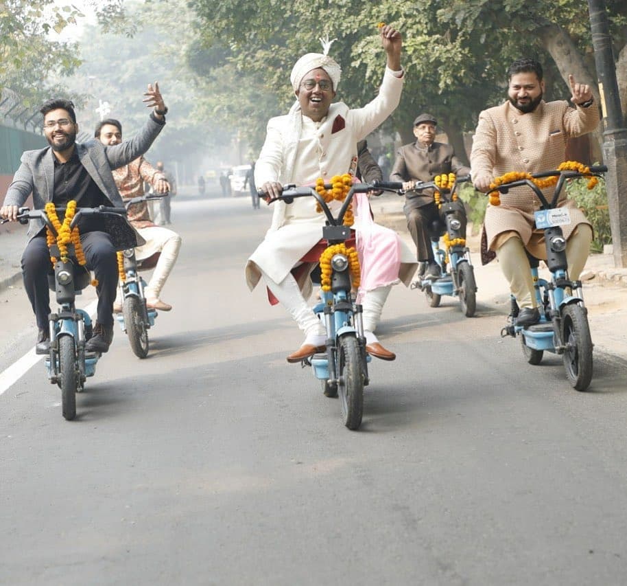 Aditya, the groom, arrived on an e-bike with his baraat to the wedding