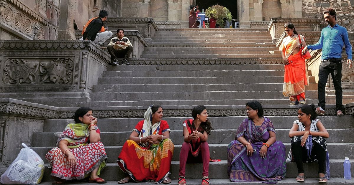 Women in Maheshwar (MP) are enjoying an afternoon chit-chat on a busy touristy day.
