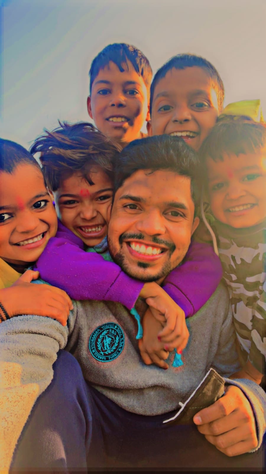 Amar Lal with some of the children he is engaged with