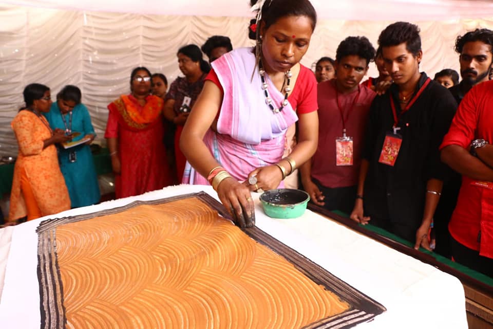Sumanti demonstrating her art to the participants of Samvaad.
