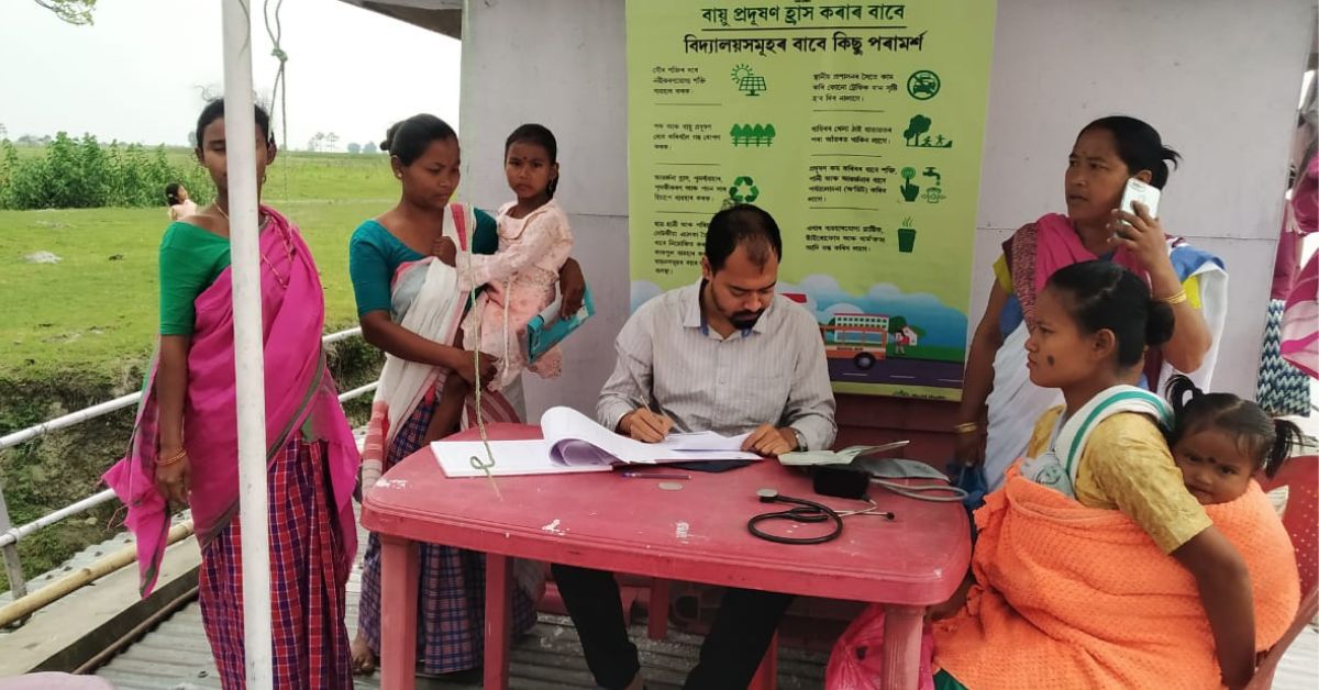 The team rows from village to village across the district organising health camps.