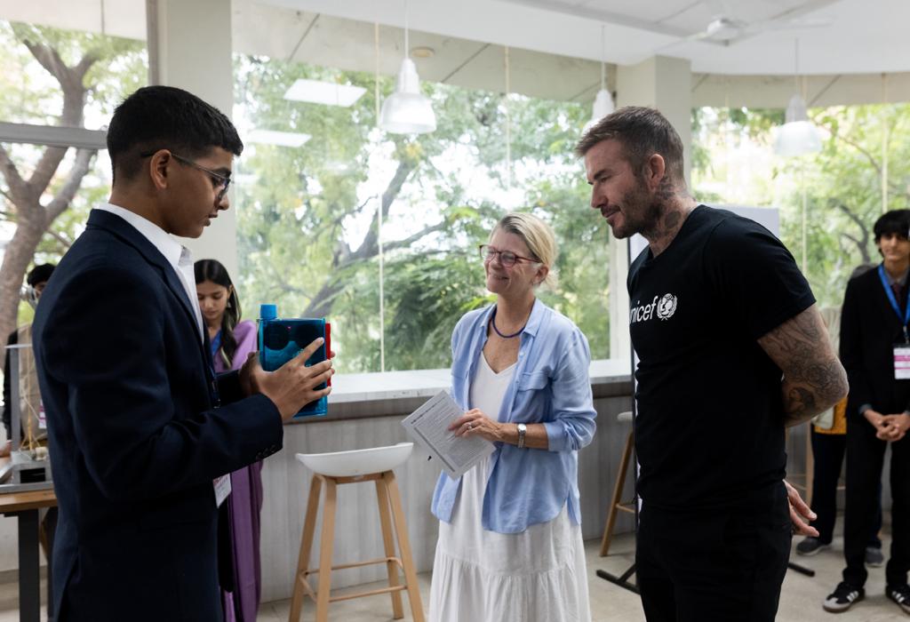 Nikhil explaining his innovation Meditel to UNICEF Goodwill Ambassador David Beckham