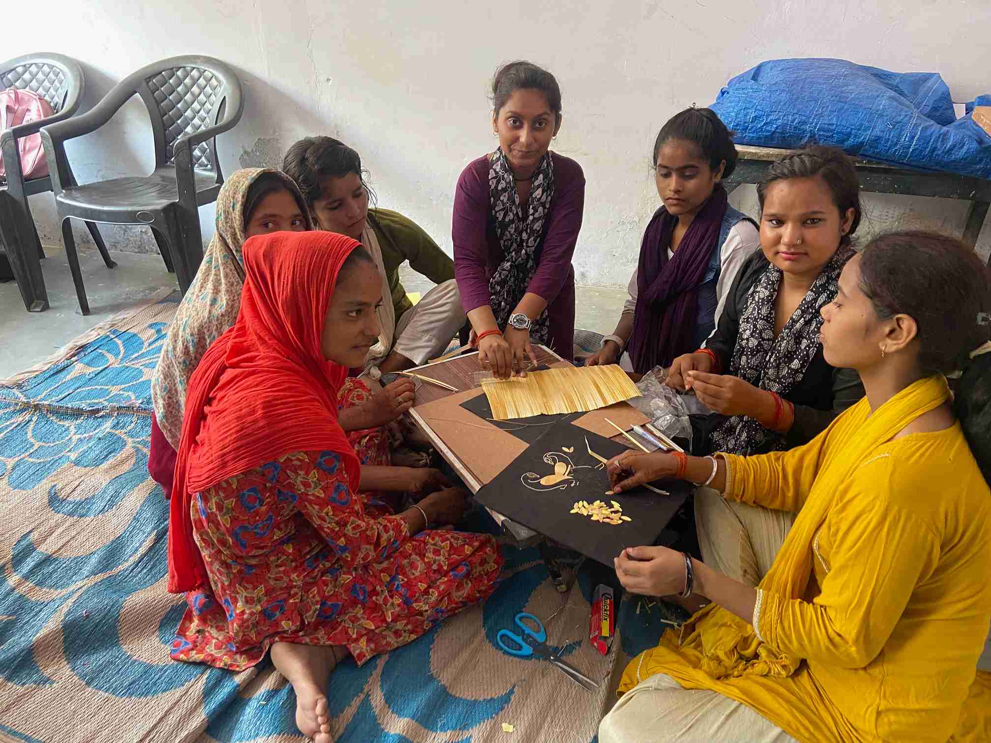 Rachna teaching her students at her shop and training centre.