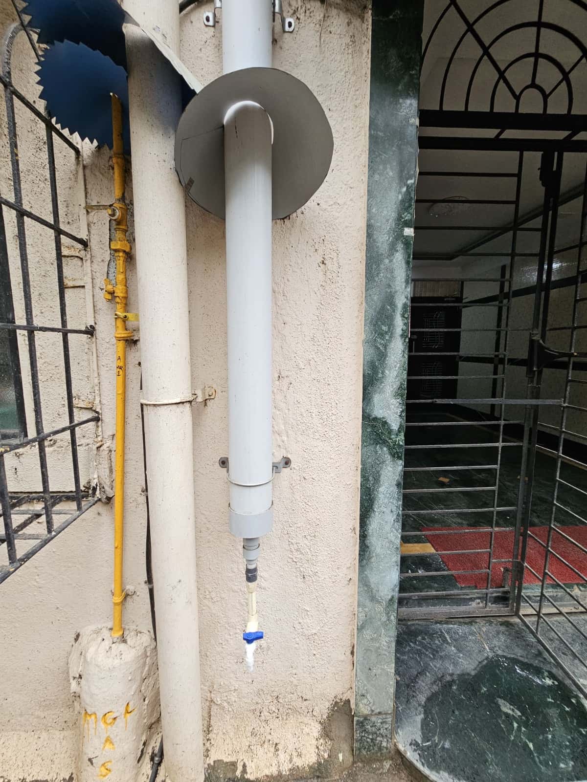 This pipe collects AC condensate water