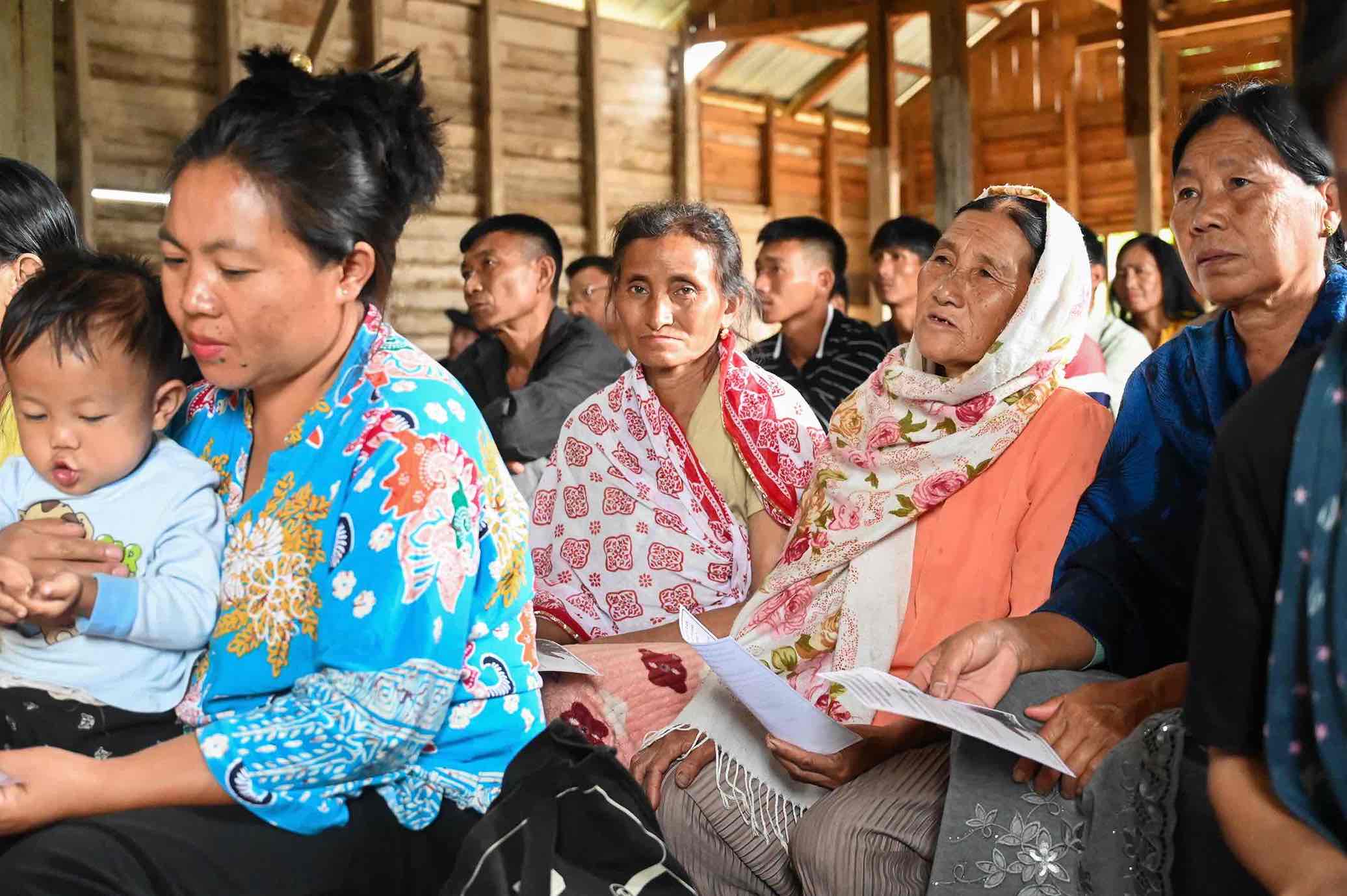 People participate in a community event centred around the protection of pangolins.