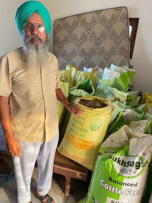 Phuman Singh with sacks of carrot seeds