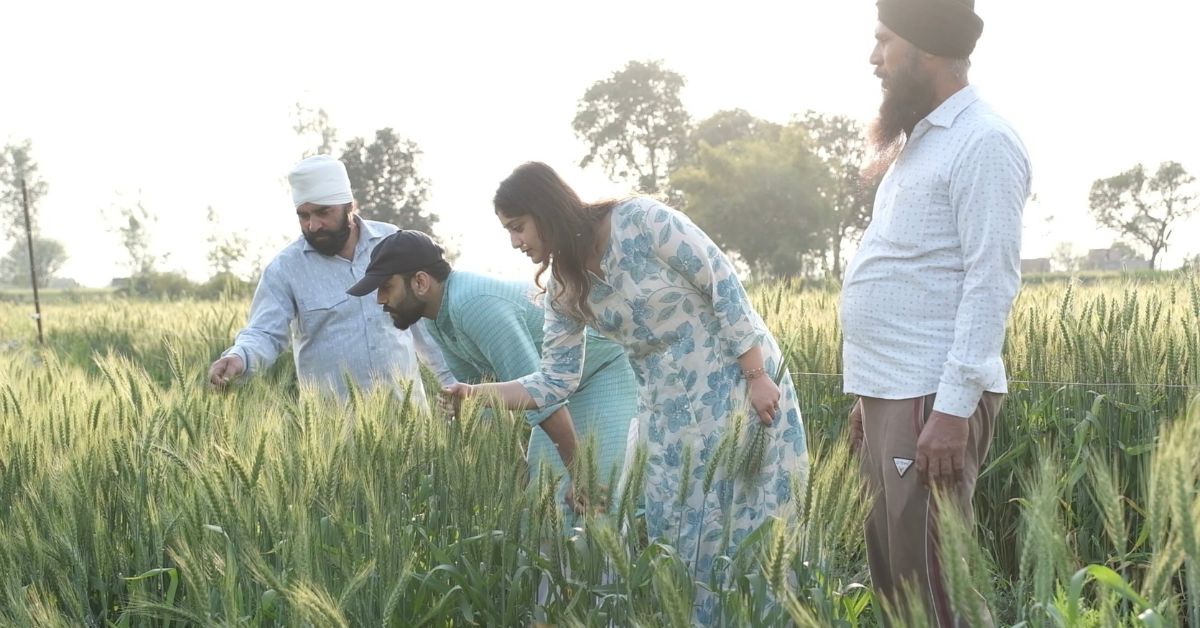 Prateek and Aishwarya studying plants with farmers 