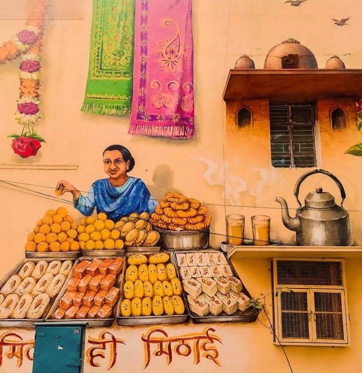 Sweets being sold on the streets of Lodhi is depicted in a mural painted by Yip Yew Chong