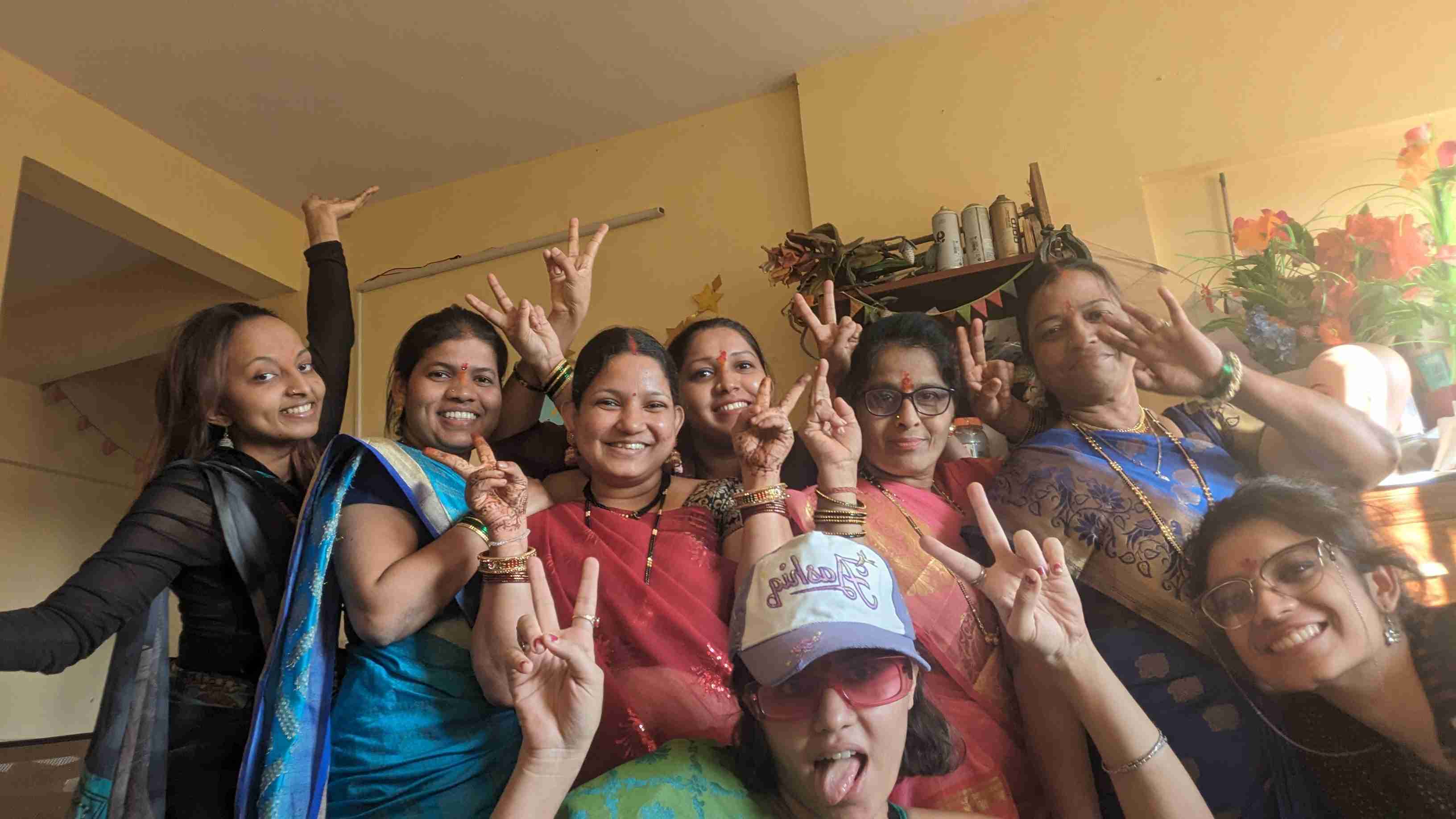 Prakruthi Rao and Akshara Mehta pose with their all-women team of workers at Juhu Beach Studio, smiling together in a supportive and creative environment.