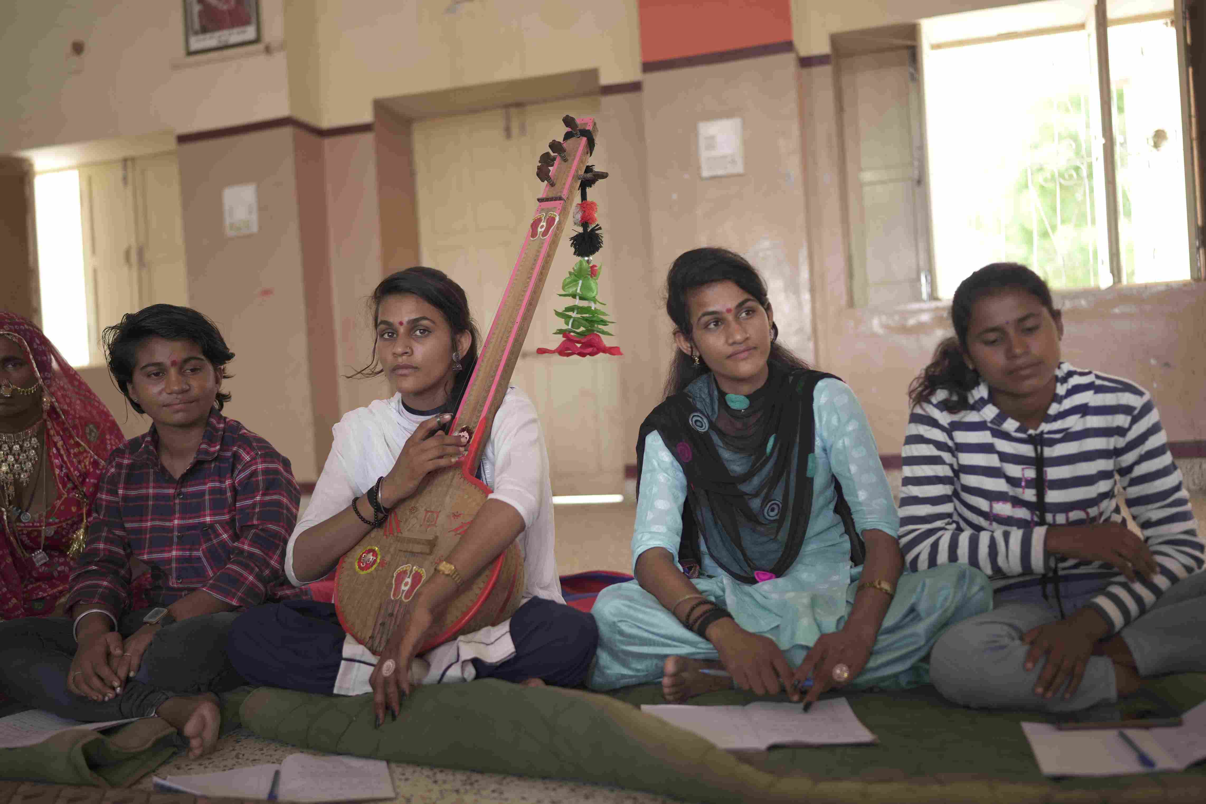 Young women from Rajasthan’s folk music communities performing together at the Lok Sangeet Shala residency, showcasing their talent and confidence in a supportive and trusting environment.