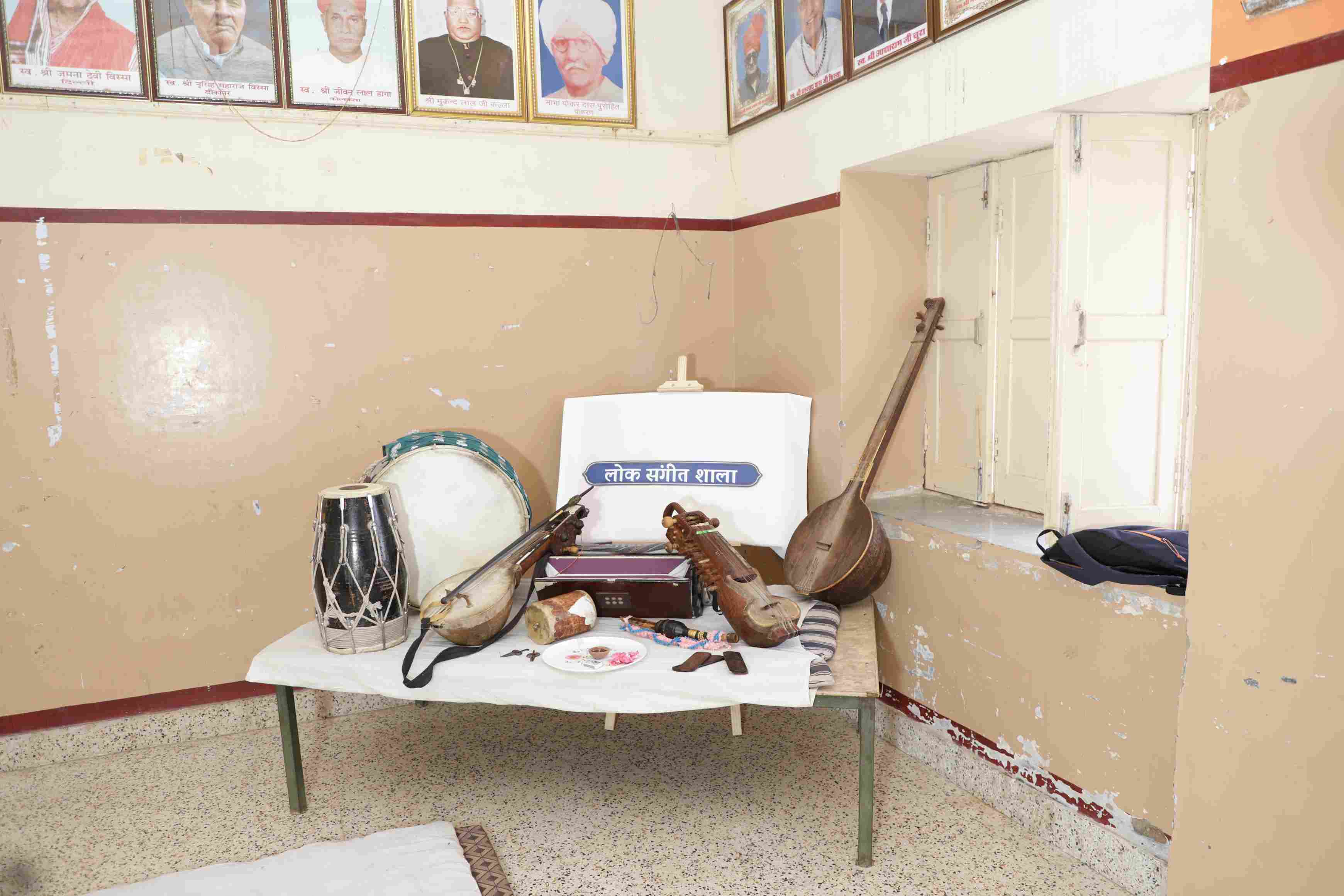 Collection of traditional Rajasthani folk instruments: khartal, kamaicha, sarangi, alghoza, and morchang, showcasing the rich musical heritage of Rajasthan.