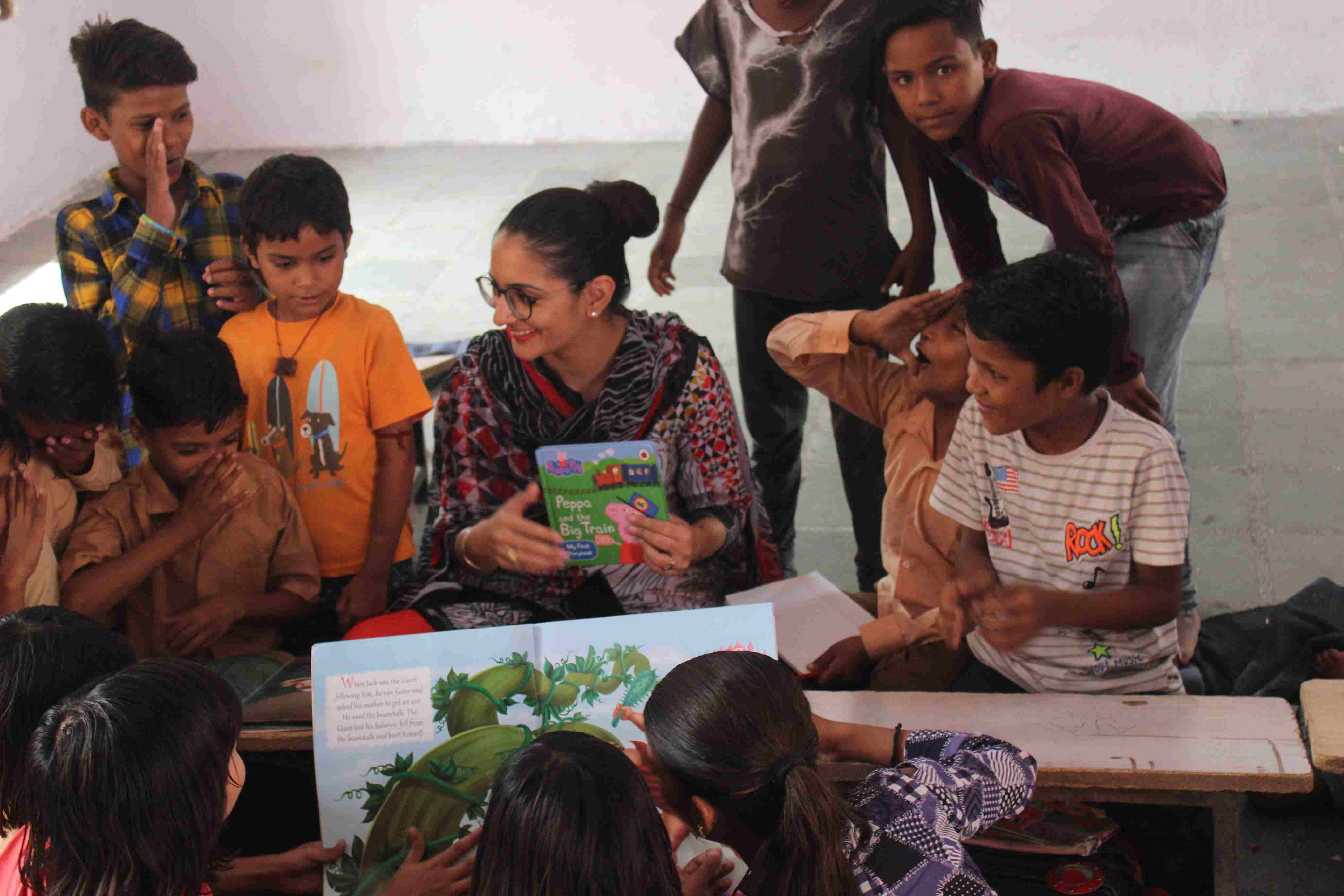 A volunteer conducting a storytelling session, engaging a group of children with a lively narration.