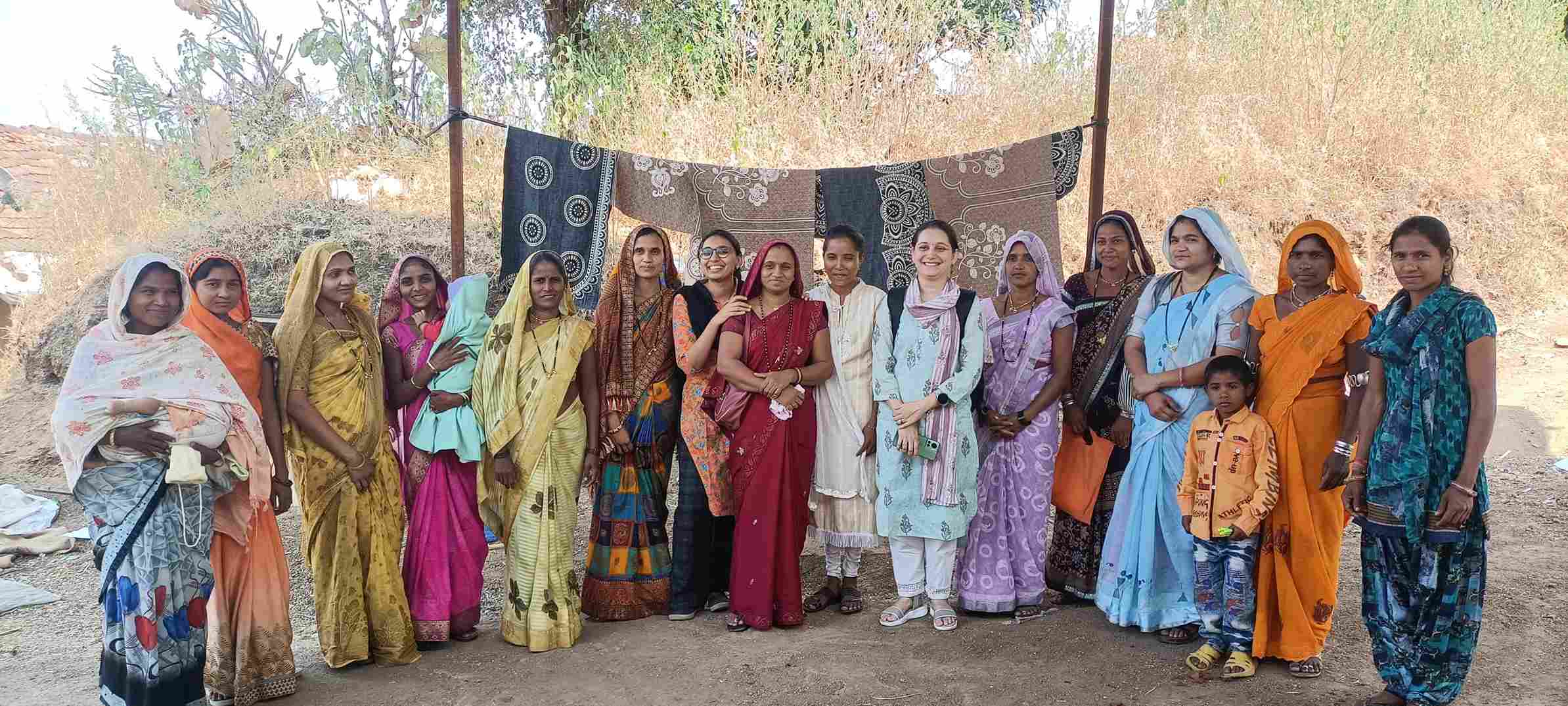 A group of women from the same community who actively participating in a socio-political discussion during village meetings.

