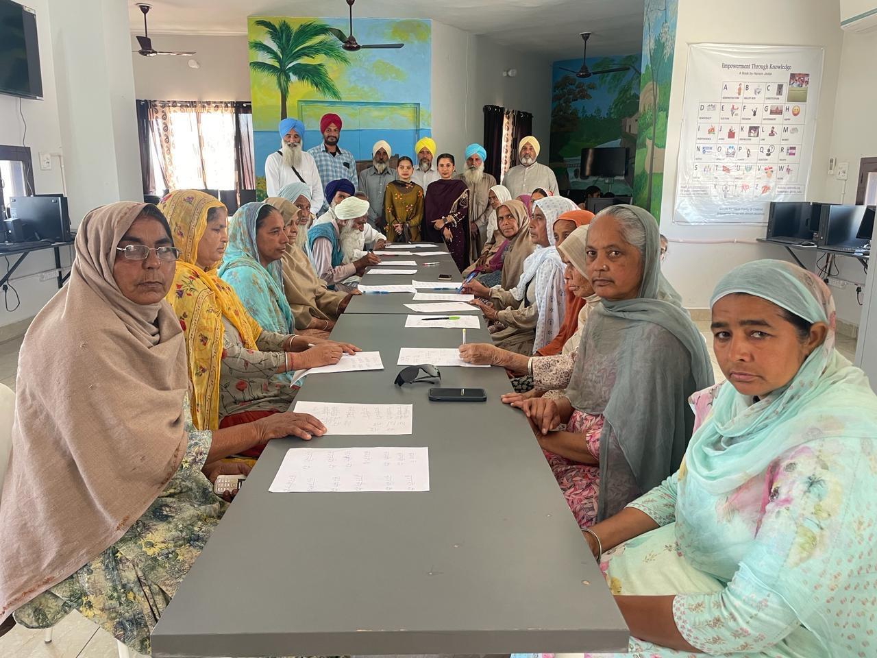 The elderly students in Bebe Bapu School have learnt to sign documents