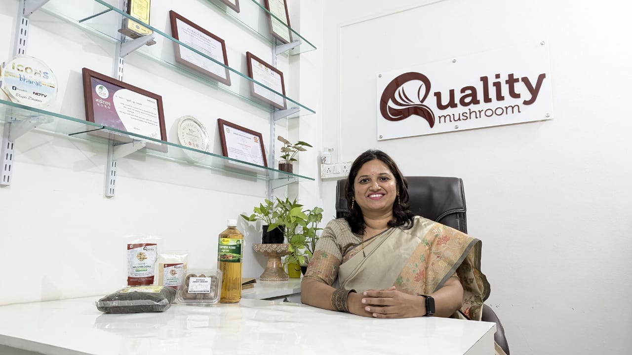 Trupti in her office, working on sustainable mushroom farming strategies and overseeing her thriving business.