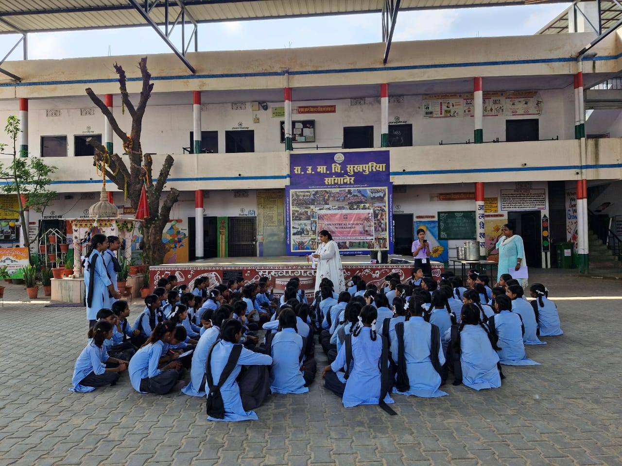 Preeti speaking to a group of girls at a government school in Jaipur, educating them about menstrual health, the importance of hygiene, and empowering them to speak openly about periods without shame.