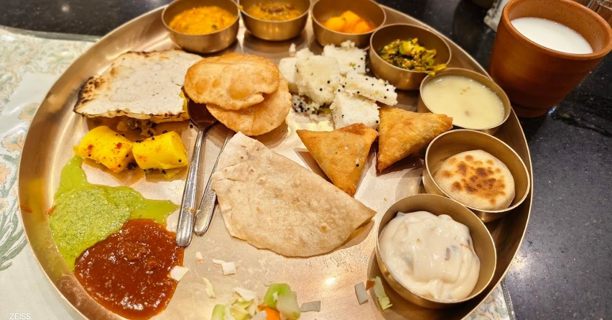 The thali at Gordhan Thal features Gujarati-specific savoury snacks, curries, undhiyu and desserts