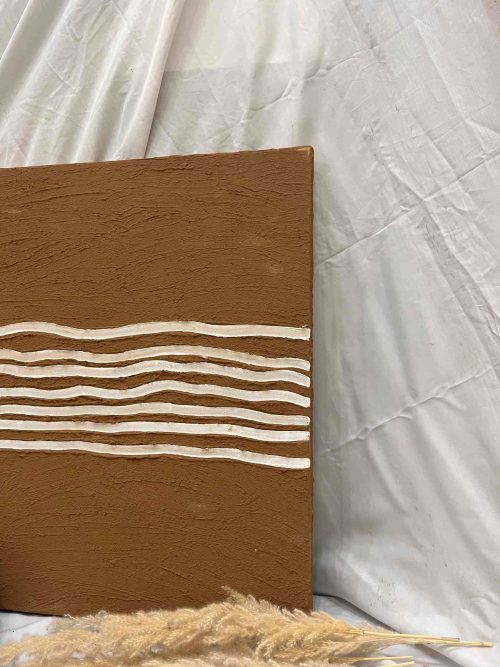 A brown and white abstract painting featuring prominent white stripe across the canvas.