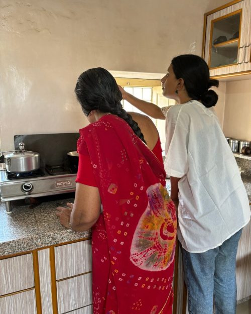 Manju 'maa' and Dipali, sharing stories and recipes in Manju's kitchen in Churu, Rajasthan.