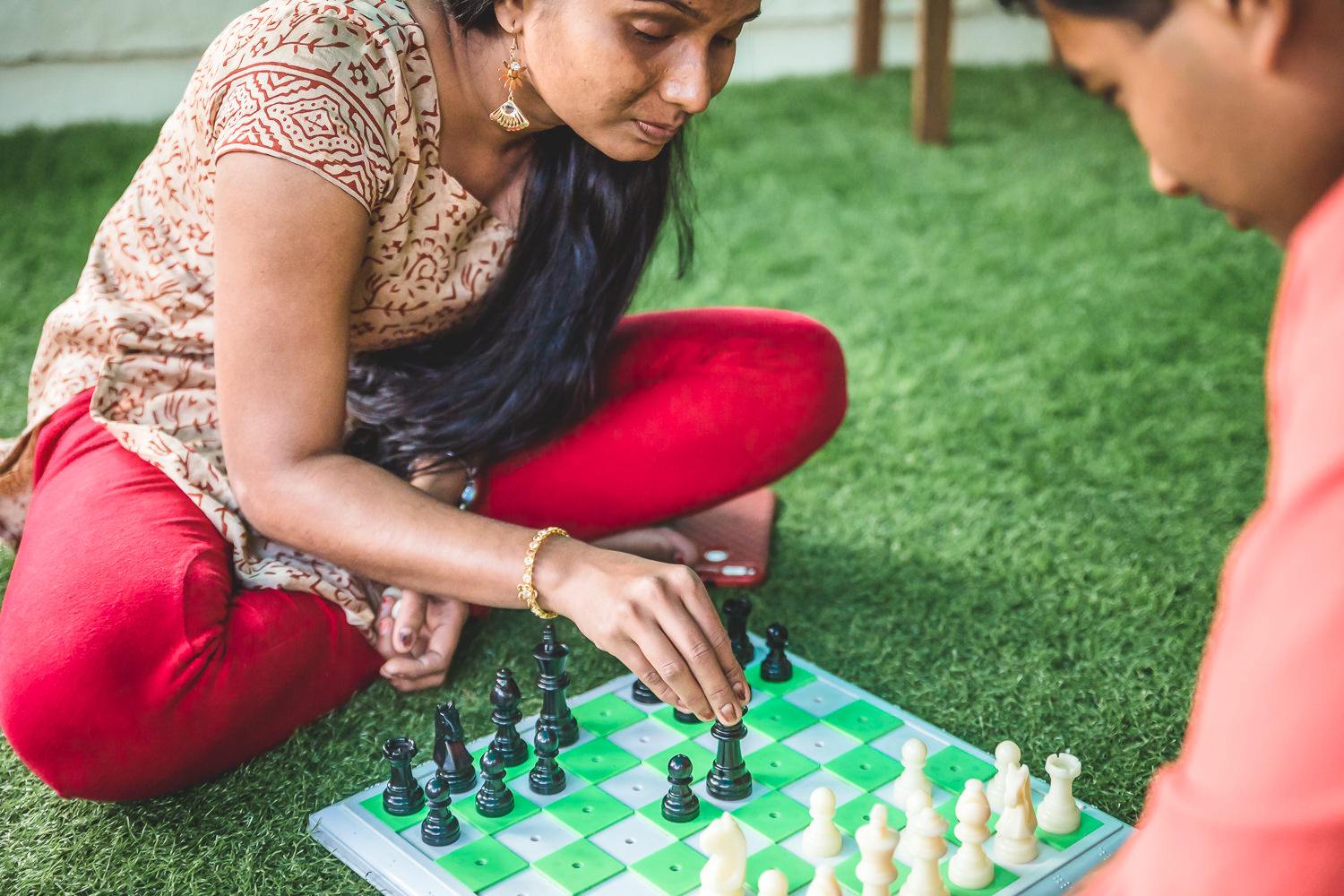 Visually impaired individuals from Niwant playing chess, promoting strategic thinking and confidence.