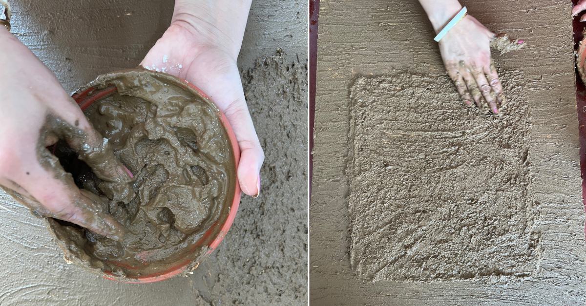 Pooja holds a bowl of mud and cow dung mixture, with a half finished piece on a table, showcasing the texture and color of the material