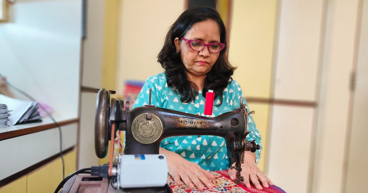 Manjusha Javier stitching her product.