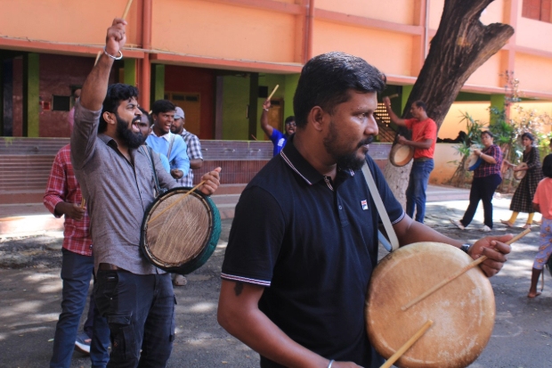 A group of people playing parai.