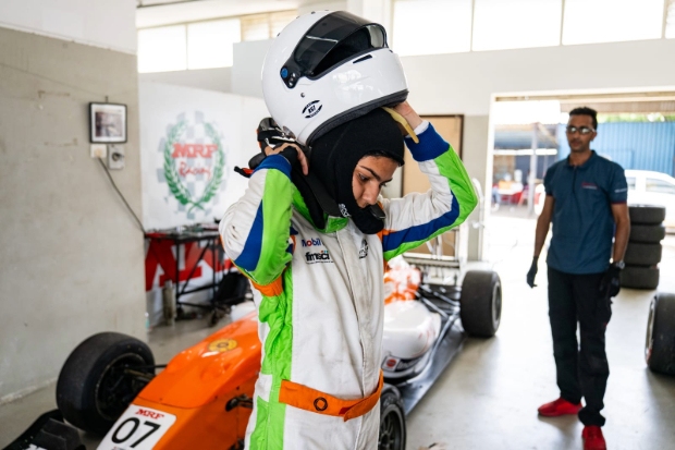 Shriya removing her helmet post the race.