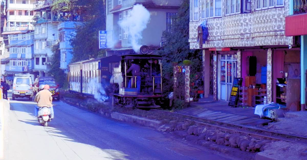 The Darjeeling Toy Train passing through a stretch near Ghum