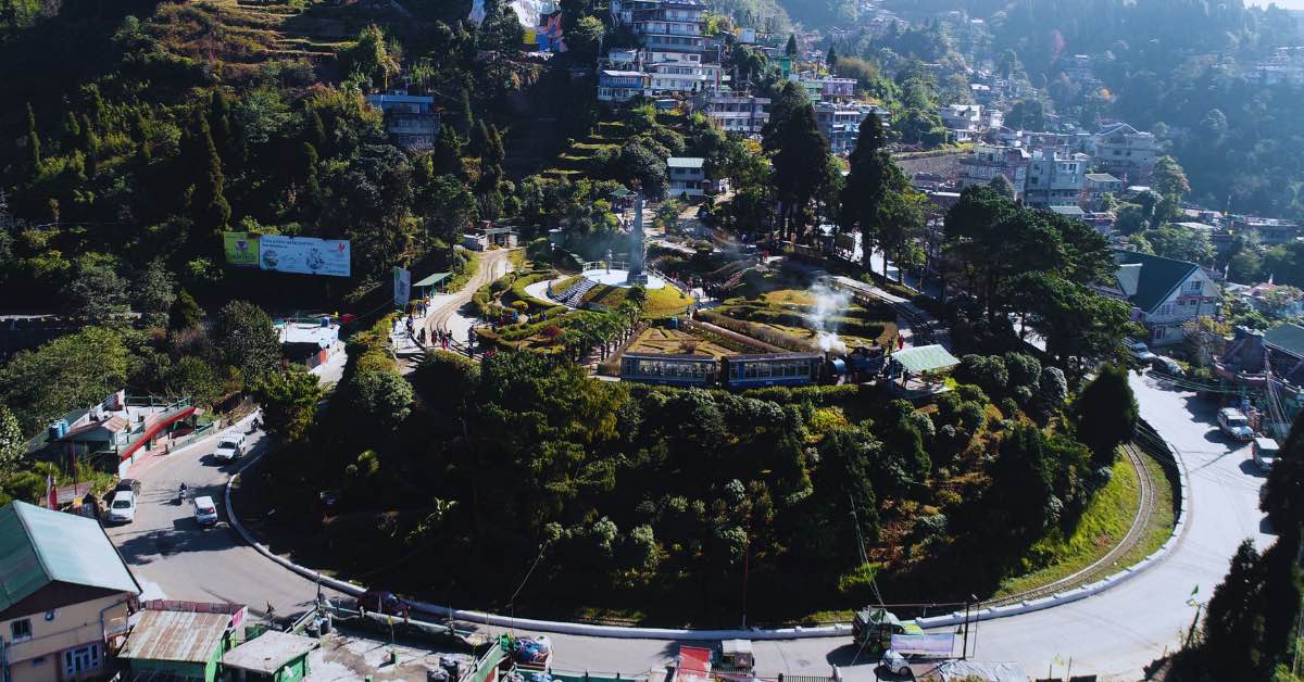 The Darjeeling Toy Train passing through Batasia Loop