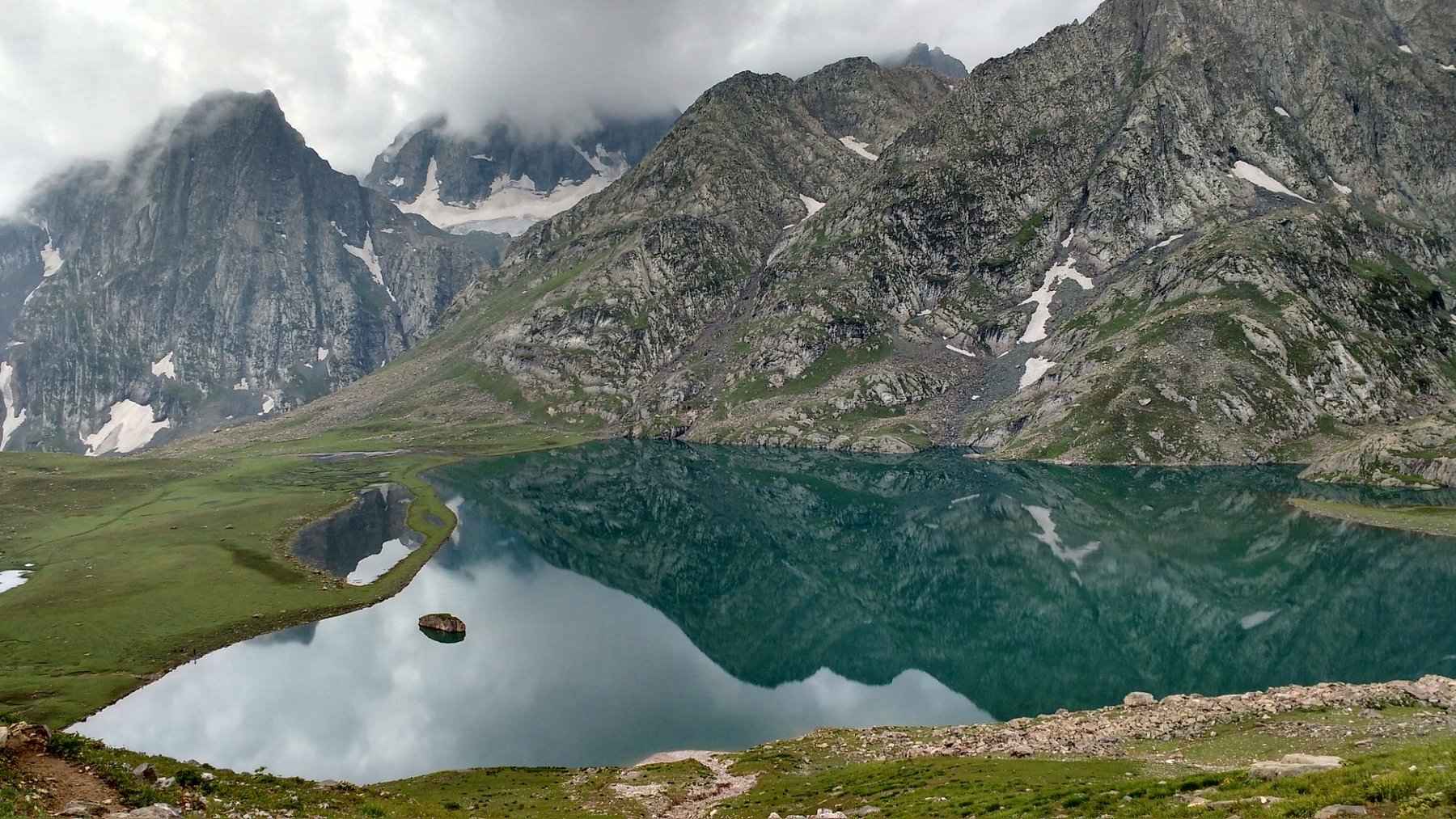 Krishansar Lake is a hidden sapphire, cradled high in the Kashmir Himalayas.