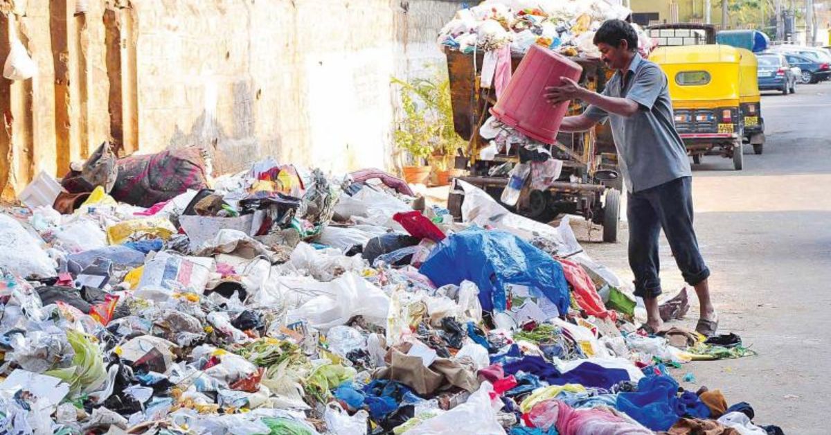 a person throwing trash on the roadside.