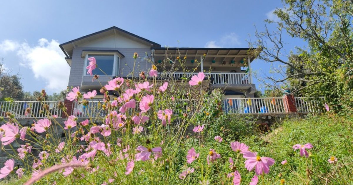 Vasanthi and Anurag’s home in Satoli, surrounded by native flowers and forested slopes.