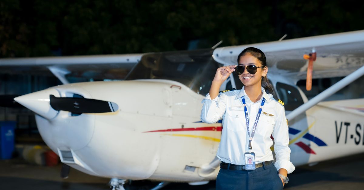 Samaira in front of a plane