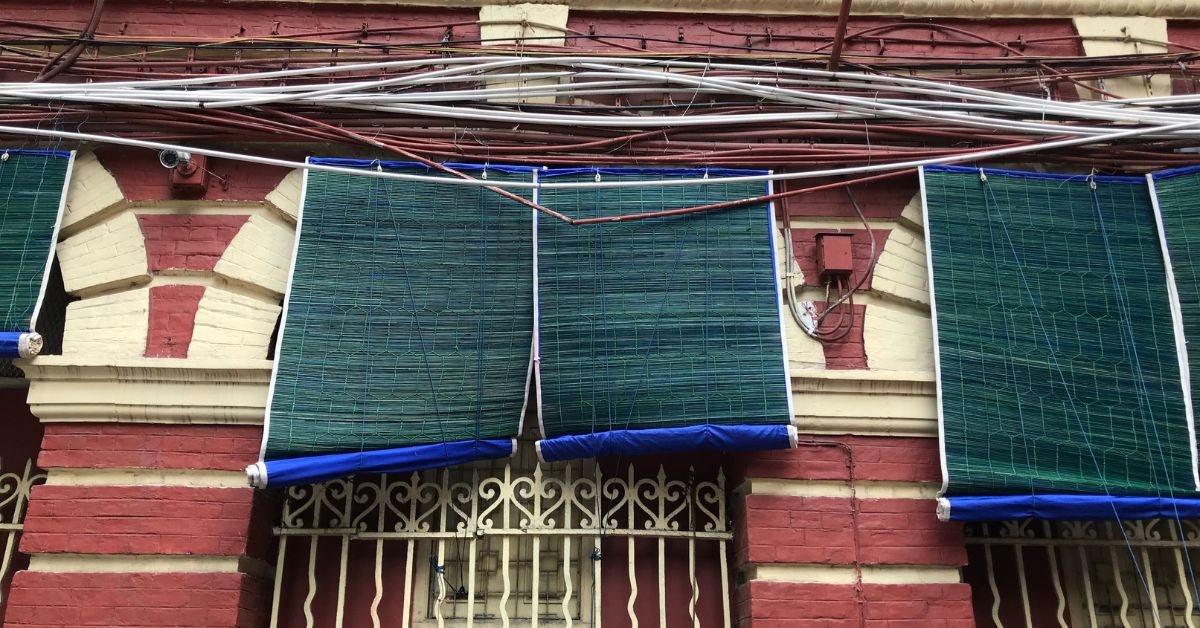 Khus mats are hung over doors and windows to keep the rooms cool.