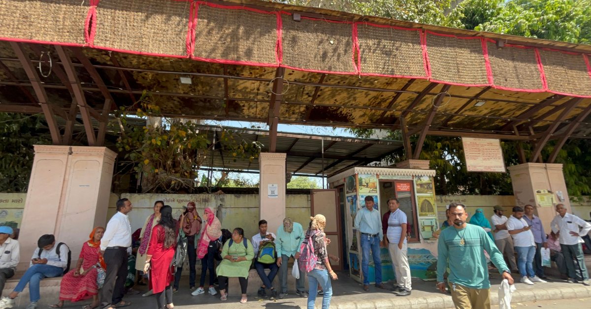 Khus curtains and misting systems turn this Ahmedabad bus stop into a heat-safe haven for daily commuters.