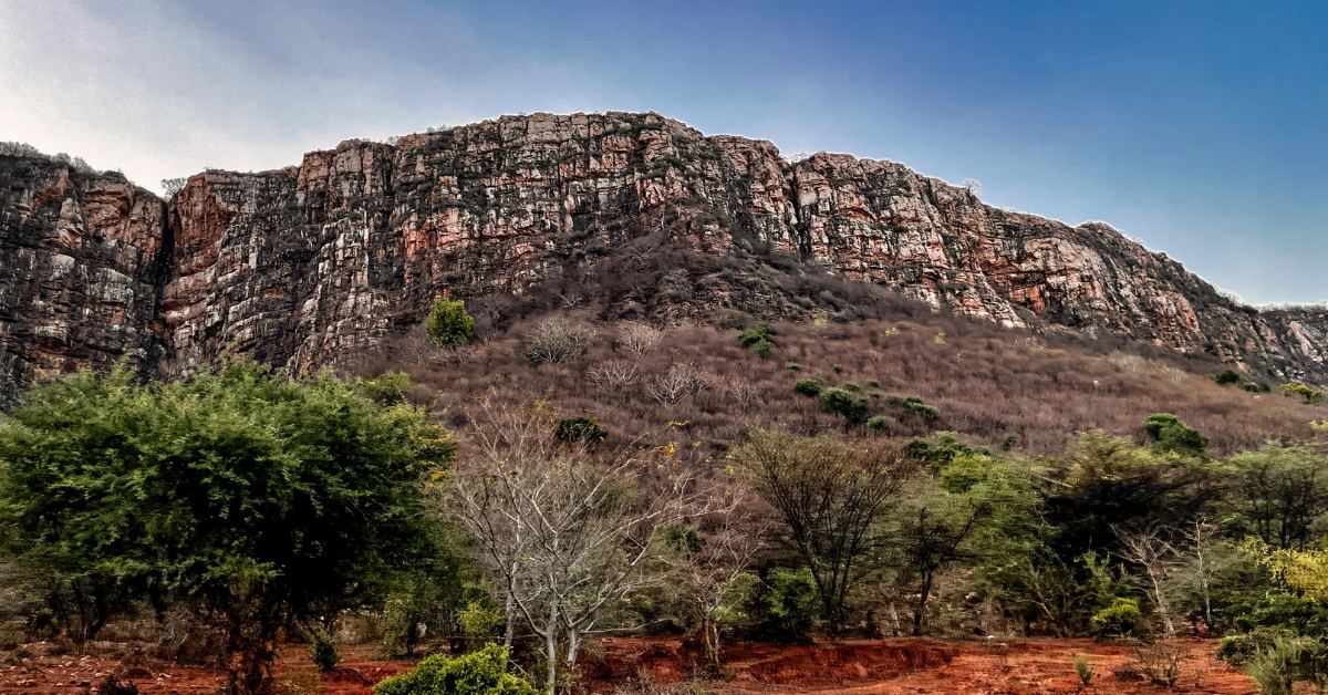 Ranthambore Fort rises from the rugged Aravalli hills—its red cliffs whispering centuries of resistance, devotion, and royal ambition.
