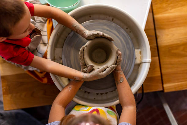 Use air-dry clay or modelling dough and help your kids to shape simple items; Picture source: iStock
