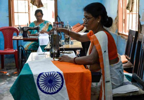 The Indian national flag must be made from cotton, silk, or wool khadi, but polyester and other synthetic materials are strictly prohibited. In 2022, the Indian government amended the Flag Code to allow machine-made flags using polyester, sparking debate and concern among traditional khadi flag makers like KKGSS, who uphold the hand-spun heritage of the original flag design.