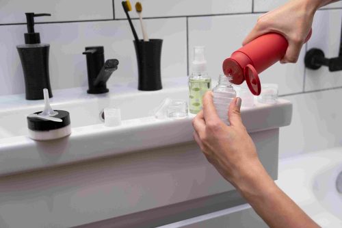 Refill your shampoo or conditioner into small reusable bottles.