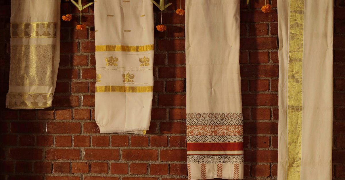 The backdrop of the wedding stage was a stunning display of sarees from the couple’s families