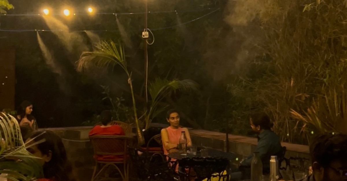 Instead of air conditioners, the cafe uses water-cooling systems and gentle misting fans to keep the space naturally cool