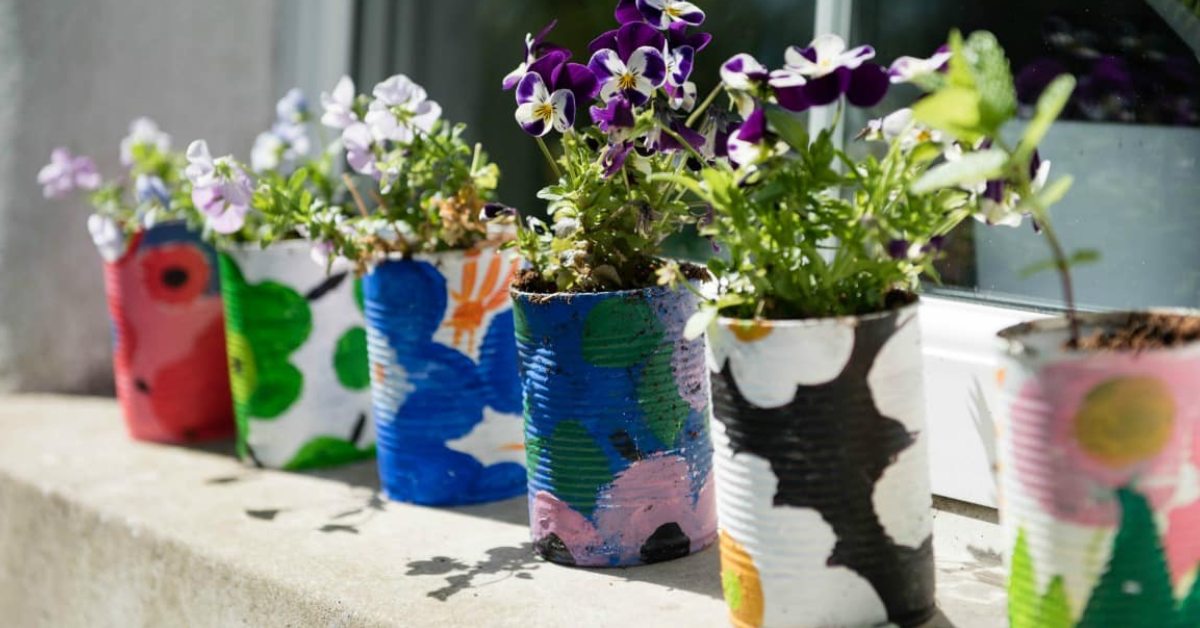 Ask your kids to implement their creativity on different tin cans and use them as planters; Picture source: Family Focus Blog