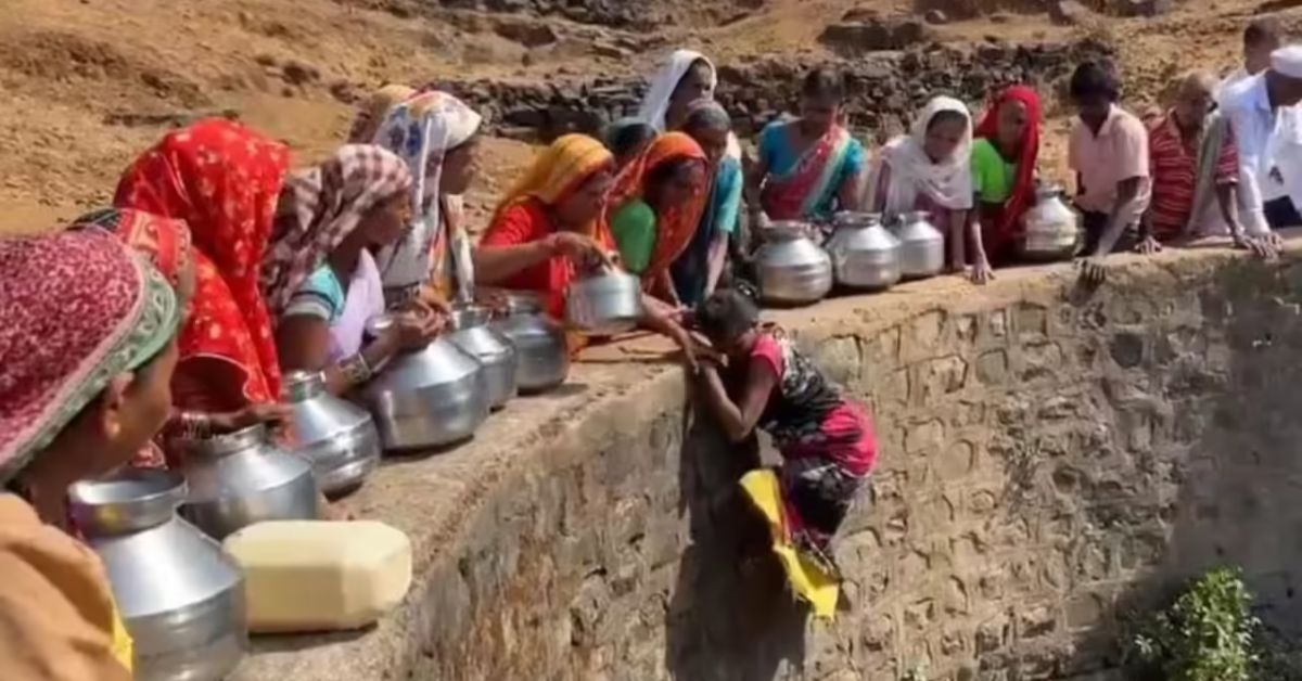 Women are often seen climbing into a parched well to source water, 