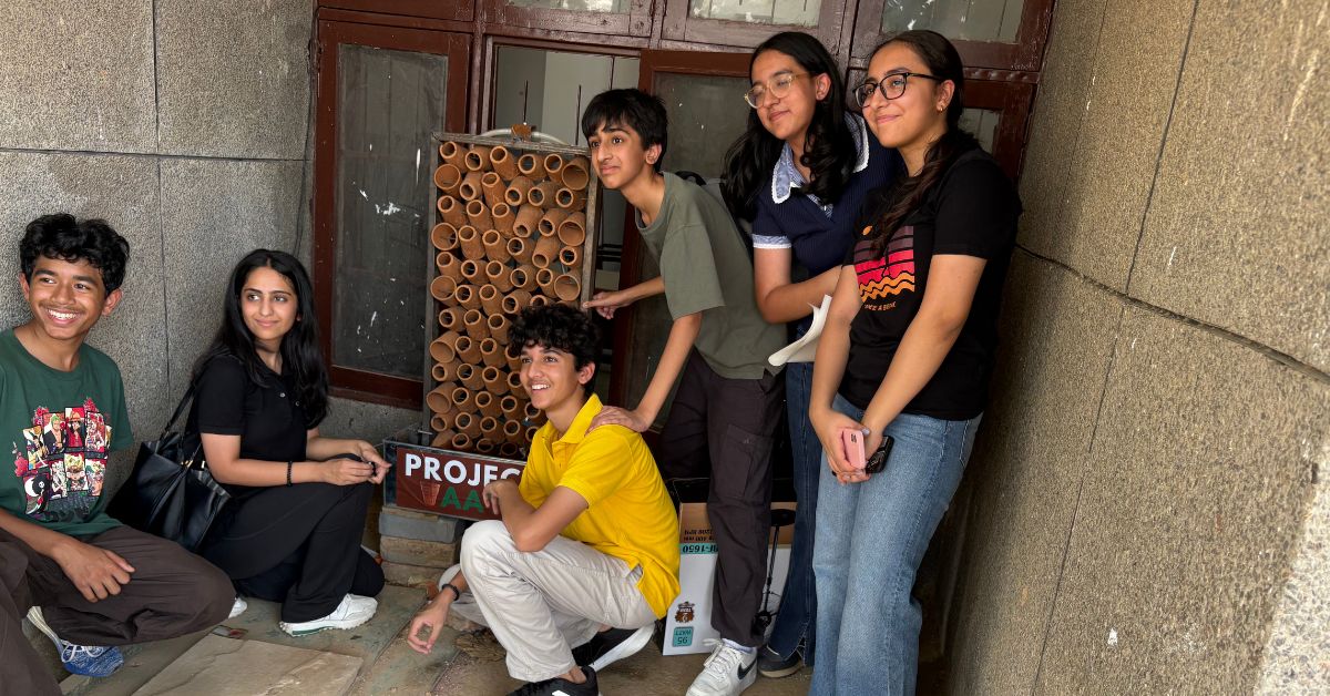 The team with their freshly installed eco-friendly cooler.
