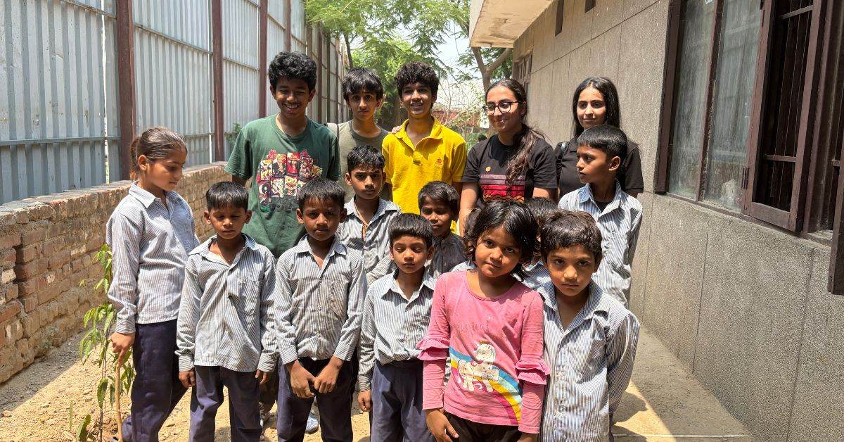 The team with the students of the Government Primary School of W1 block in Delhi.