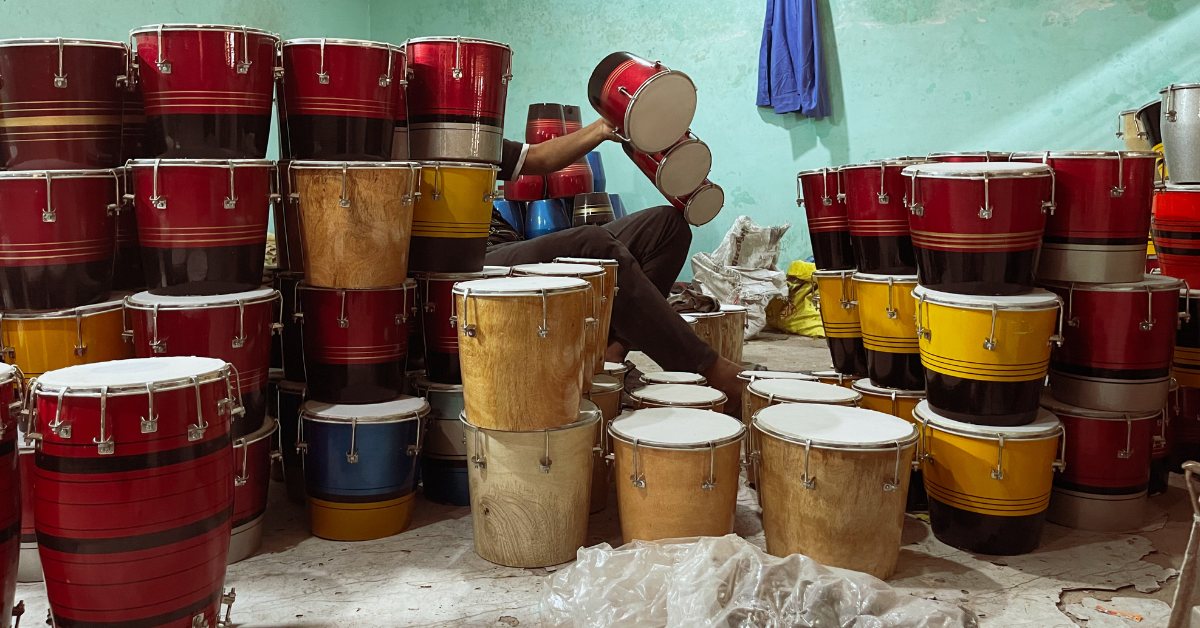 A finished tabla gleams under the workshop light, ready to carry its rhythm to the world.