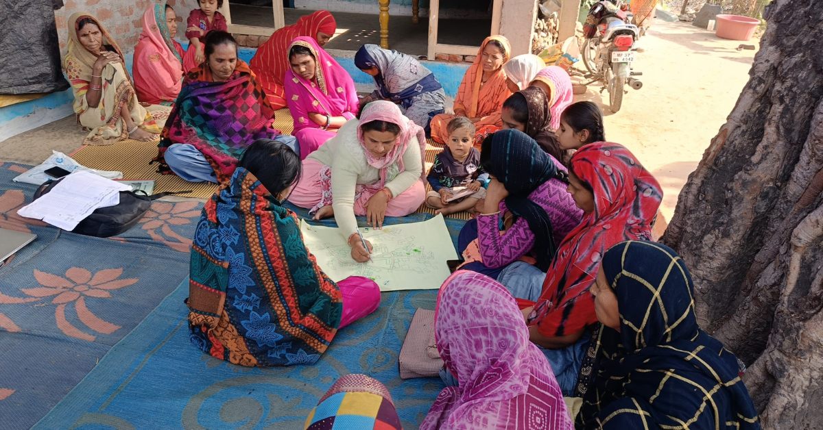Women in rural communities discuss local climate challenges, a key step in building resilience through the ClimateRISE Alliance.